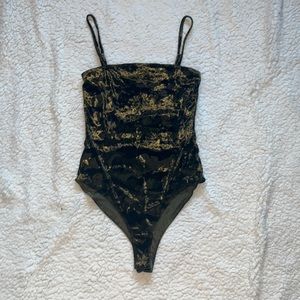 A velvet green camouflage bodysuit Size Small Forever 21